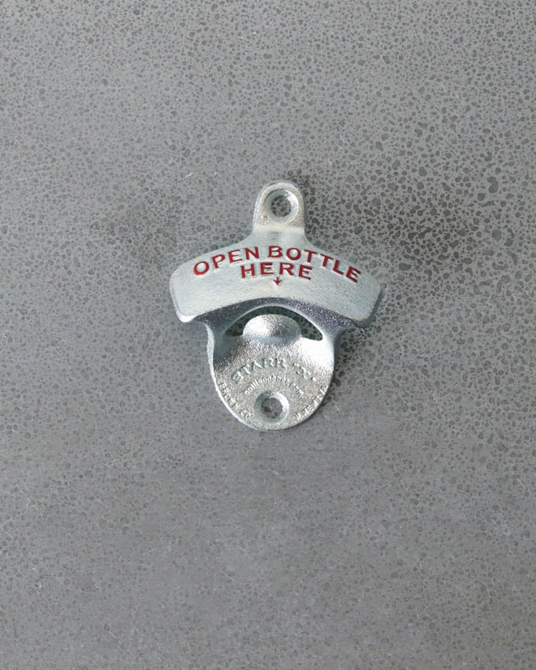Wall-mounted bottle opener