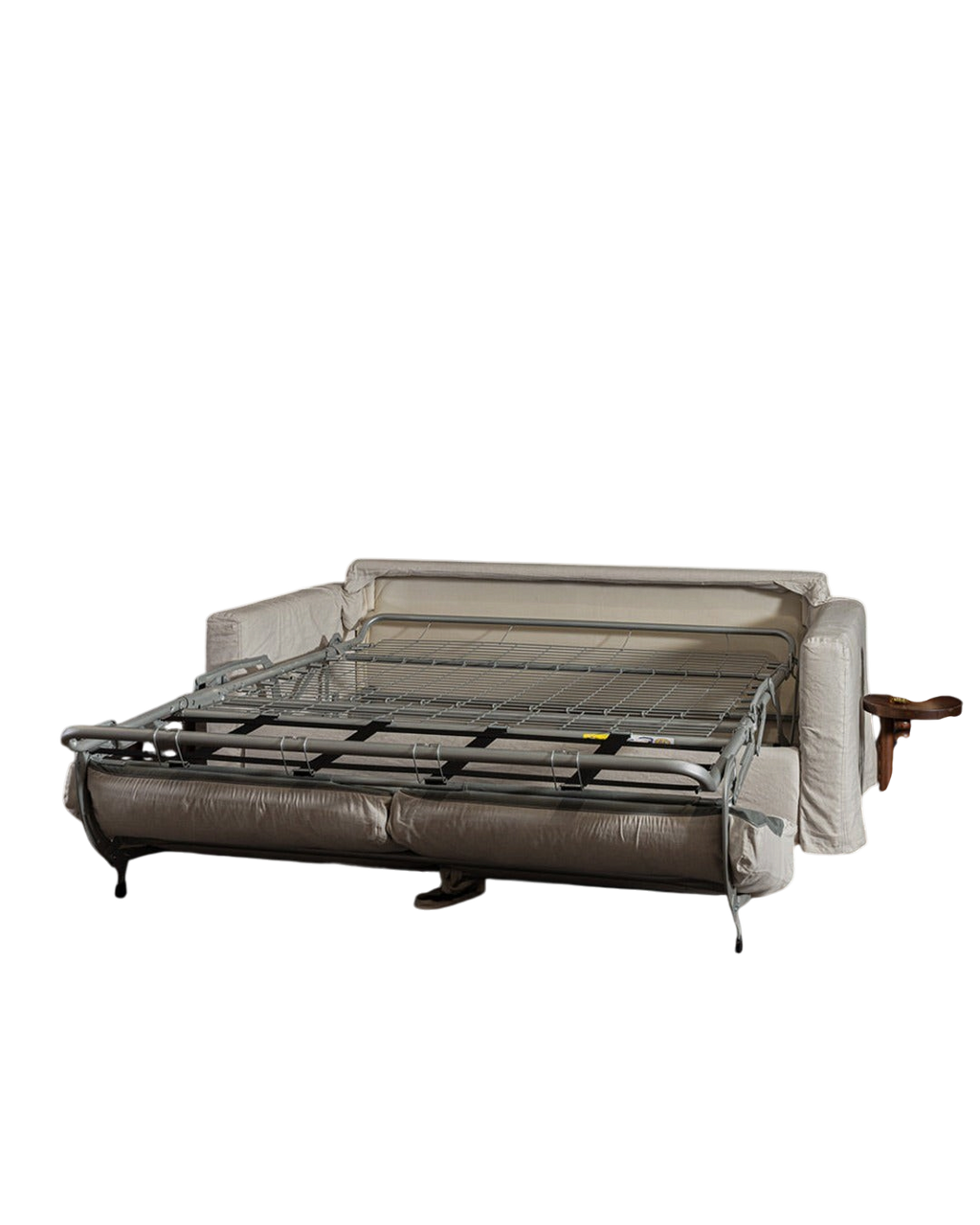 Canapé convertible Merci Paris déplié avec structure métallique apparente et revêtement en tissu beige