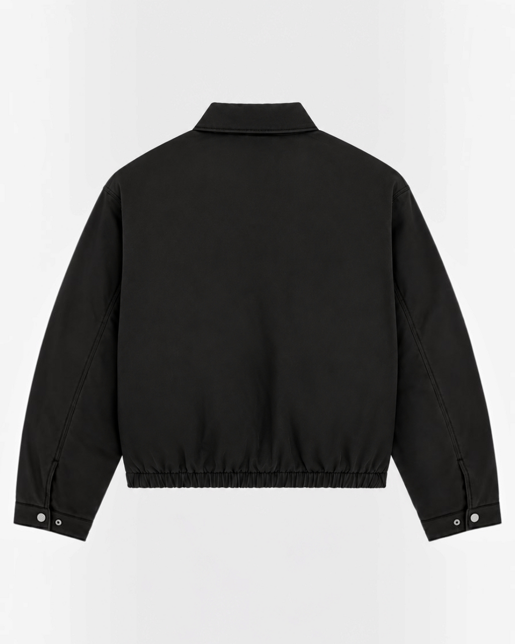 Back view of the black cotton Eisenhower jacket from Merci Paris, workwear style with elasticated hem.