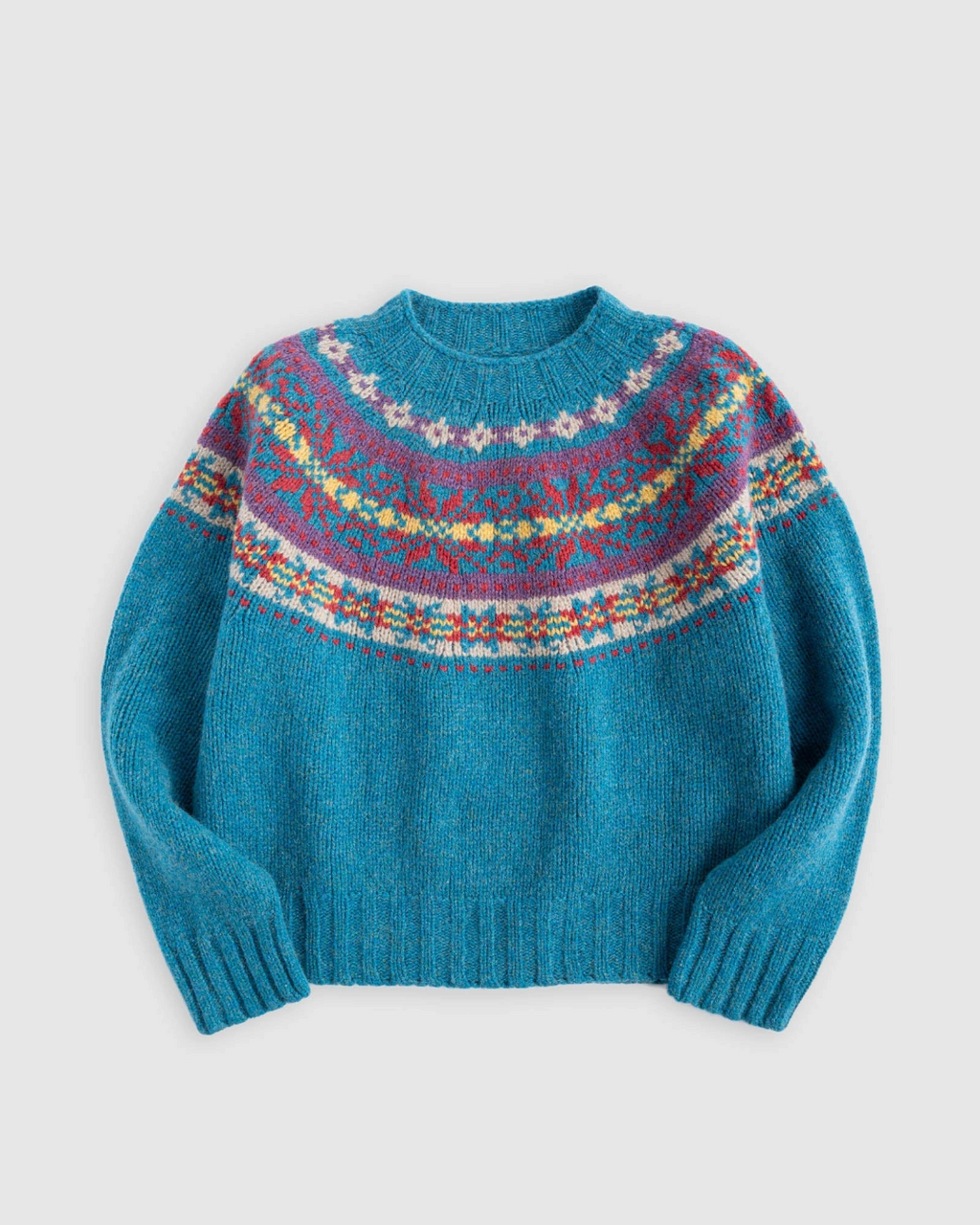 Pull Merci Paris Howlin' en laine Shetland bleue avec motif jacquard Fair Isle multicolore et col rond