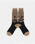 Chaussettes Merci Paris Babaco en maille jacquard marron et noir avec motif paysage de montagne, mélange laine-nylon