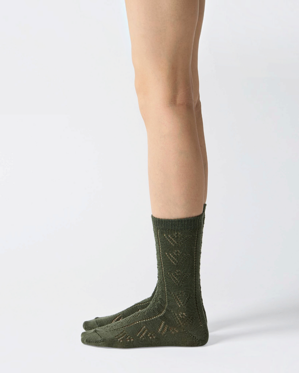 Socks Merci Paris Babaco in olive green wool mesh with delicate eyelet pattern, made in Japan