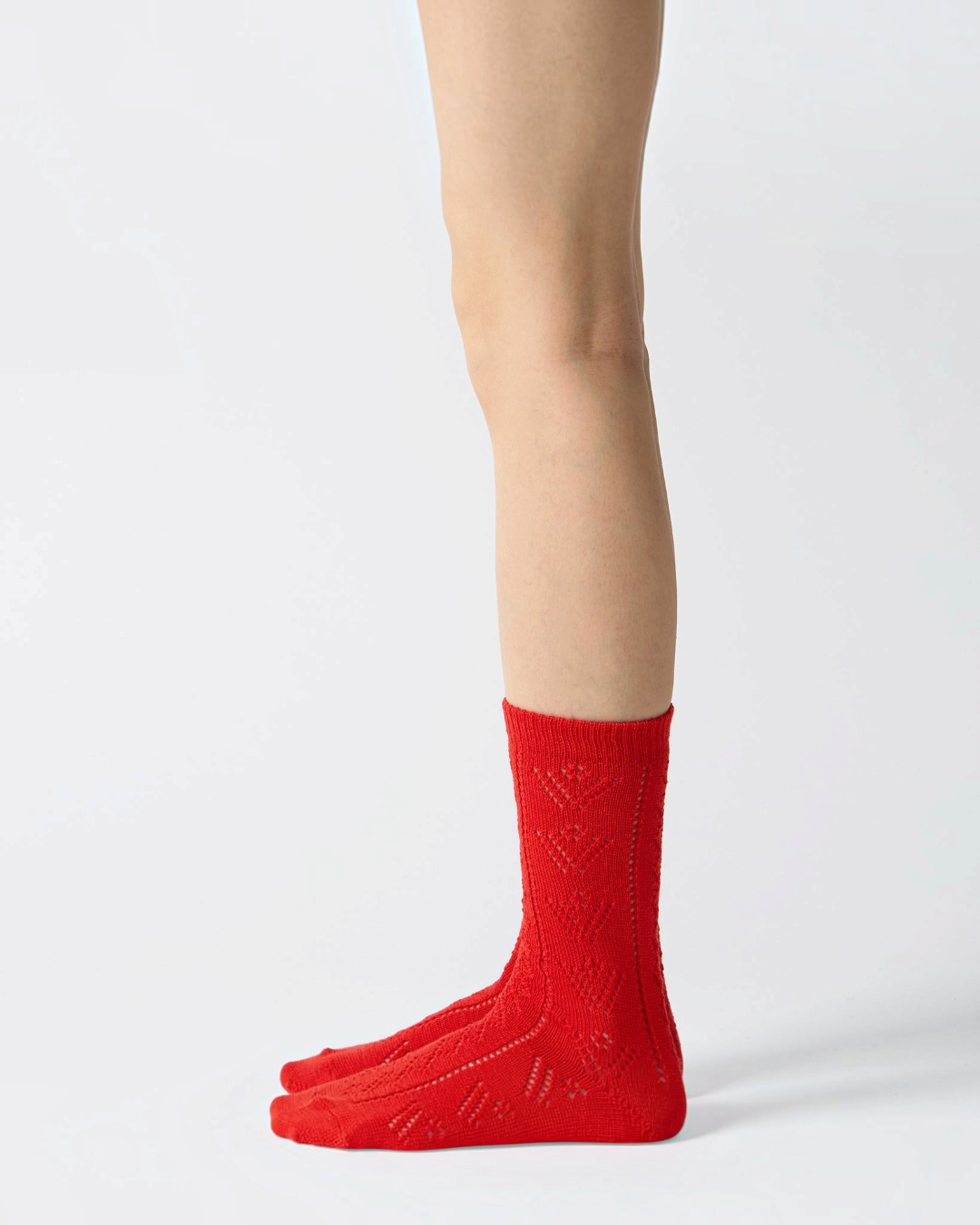 Red Babaco wool eyelet socks, feminine and handcrafted style, sold by Merci Paris