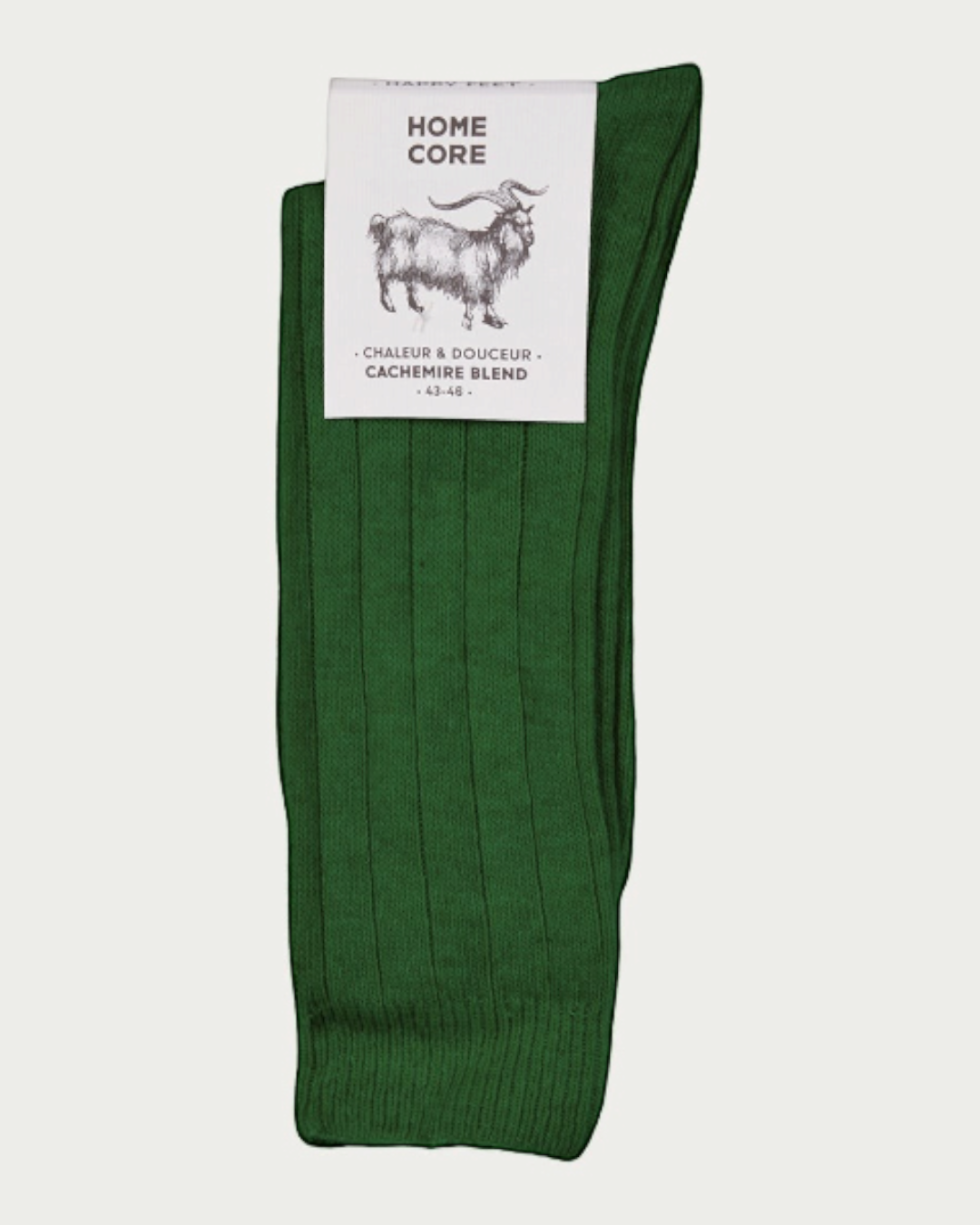 Chaussettes Merci Paris Homecore en cachemire vert avec étiquette de marque visible