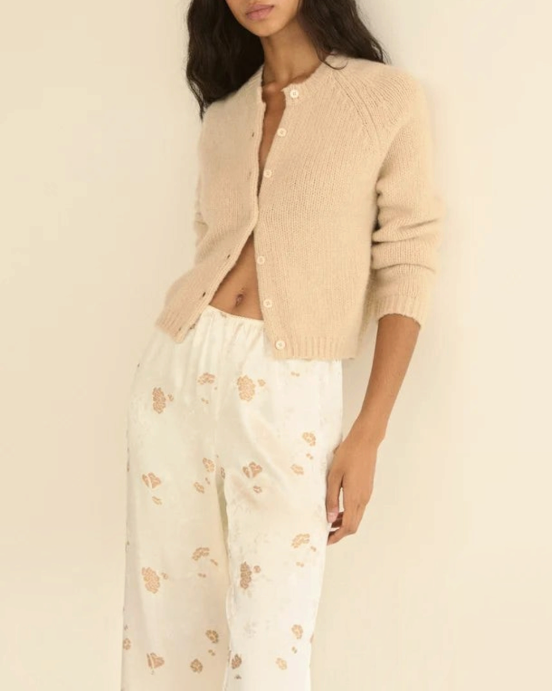 Beige Darcy cardigan in wool and cashmere Merci Paris with round collar and shell buttons worn by a woman