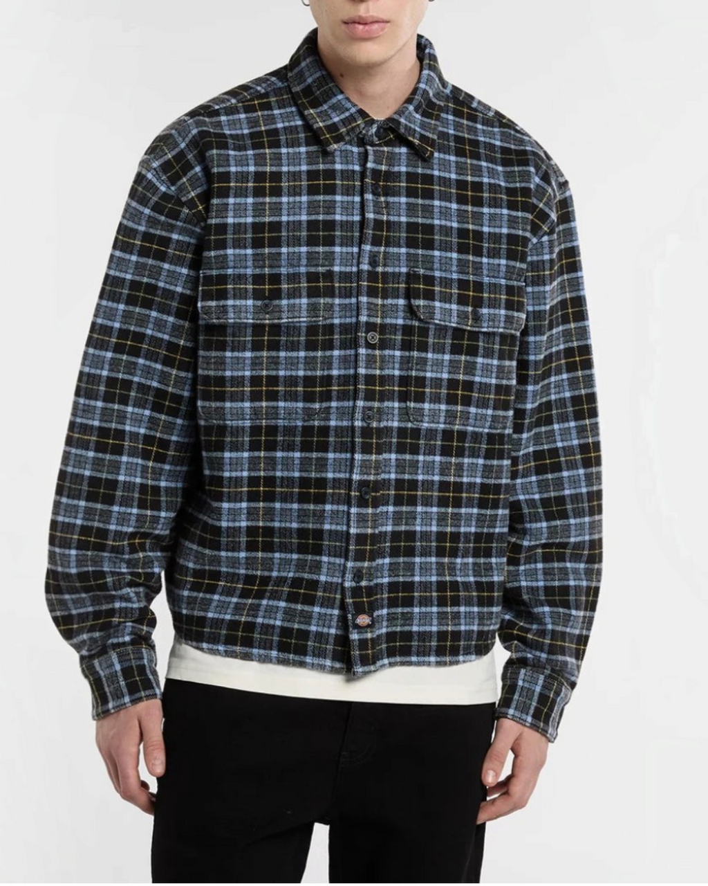Man wearing flannel shirt Merci Paris Dickies black and blue plaid with chest pockets
