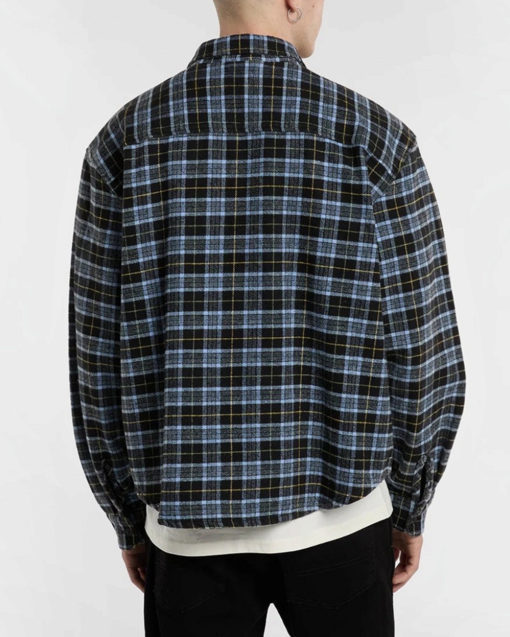 Rear view of a man wearing a shirt in black and blue checked flannel Merci Paris Dickies