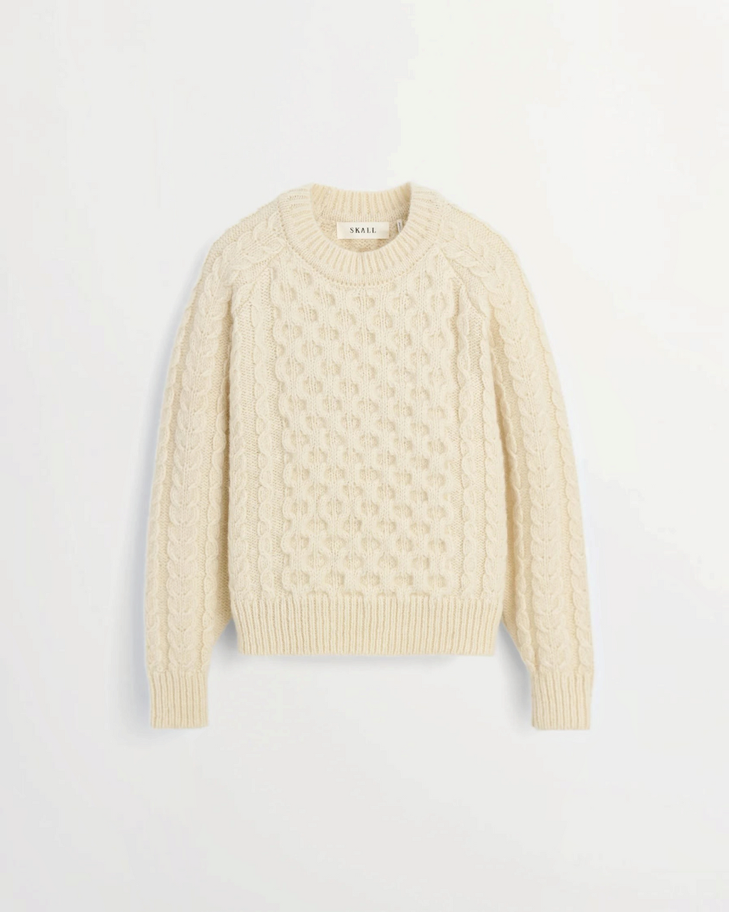White Lennox sweater in cable knit wool from the brand Merci Paris, with raglan sleeves and round neck.