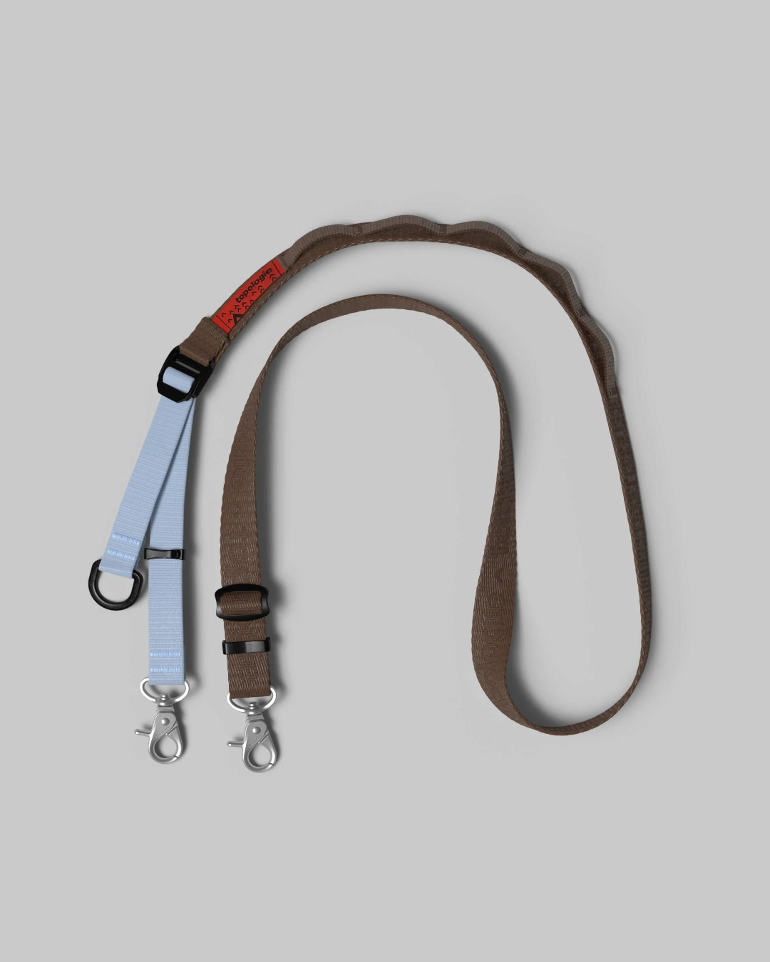 Sangle ajustable Utility Sling Merci Paris en nylon marron et bleu avec mousquetons robustes et attaches multiples