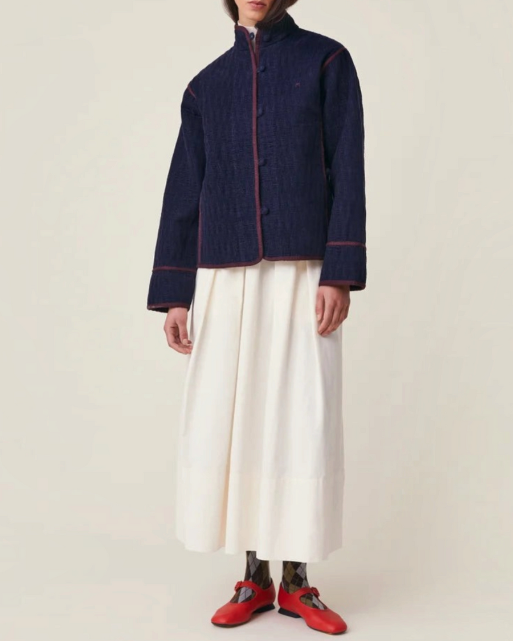 Veste Marianne Merci Paris en velours de coton bleu marine avec passepoil contrastant et boutons recouverts