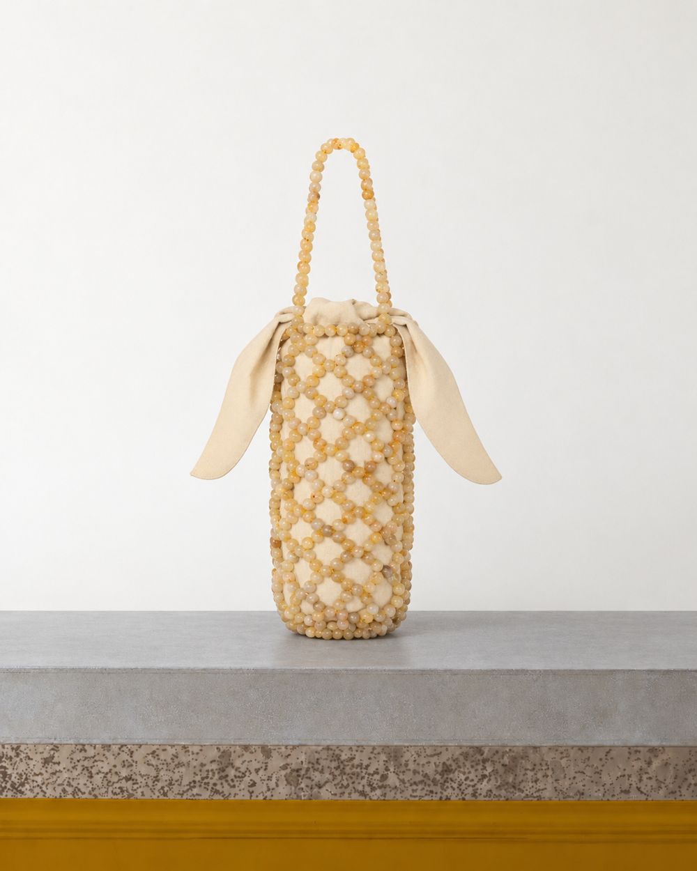 Cordera - Sac Perles Jaspe Miel - Beige – Vue sur banc