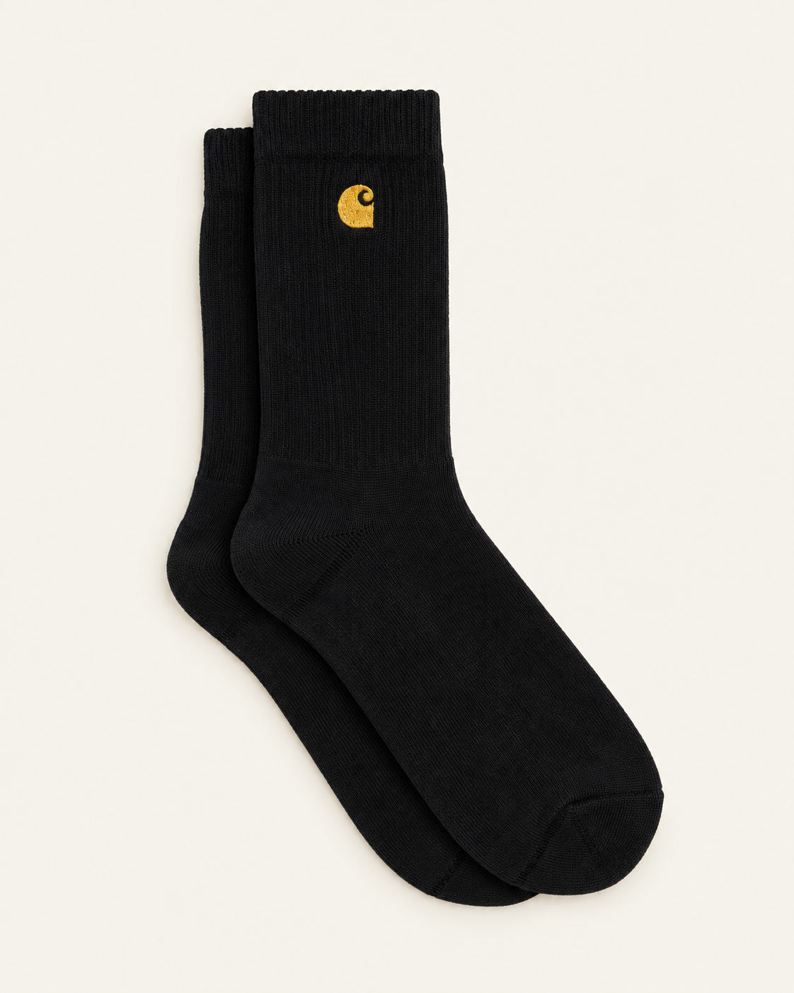 Carhartt Wip - Chaussettes Chase - Noir & Doré — paire en packshot sur fond écru